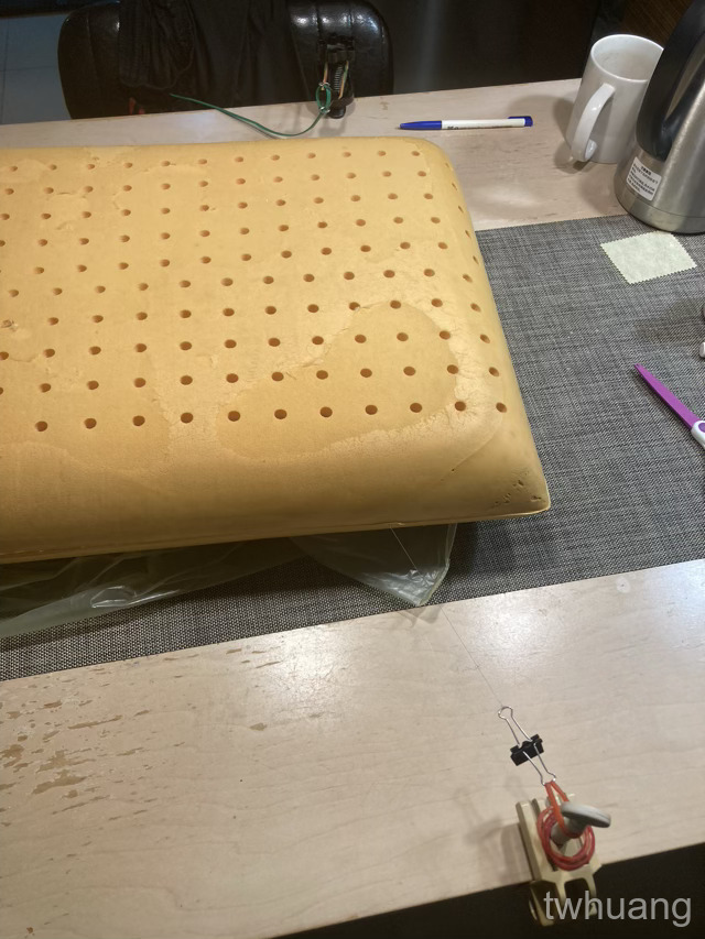 pillow on table with marker